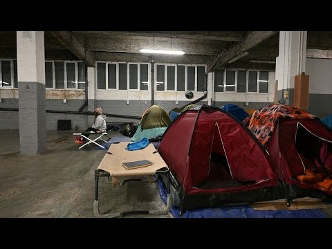 In a Paris parking lot, migrants survive out of sight